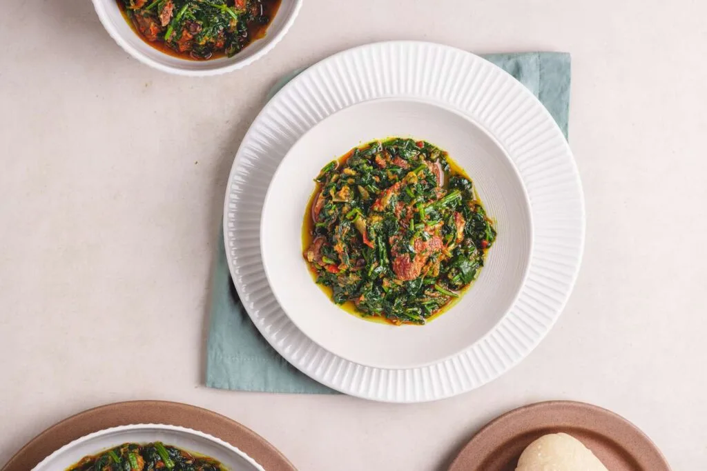Demi's Nigerian Restaurant Efo Riro in white plate - Nigerian Comfort Food